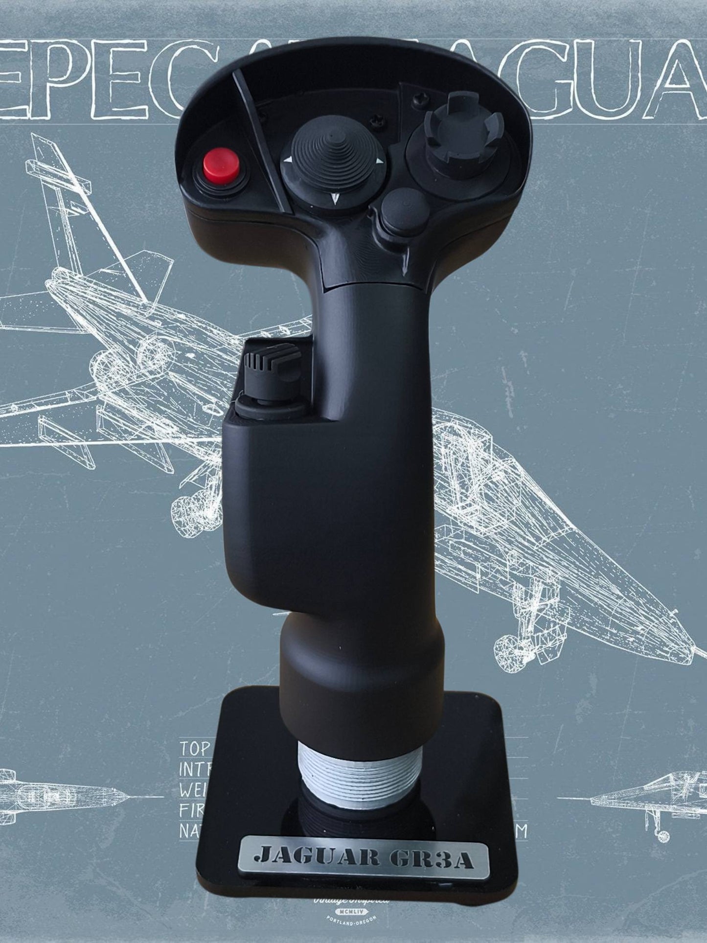 Black joystick with red button on a stand against a technical drawing background