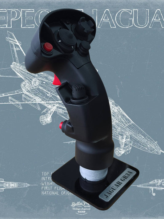 Black joystick controller with red buttons on a blue background with technical drawings