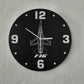 Wall clock with F16 design on a gray wall
