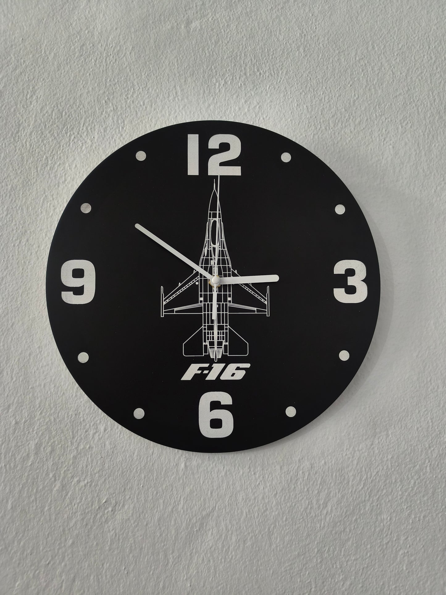 Wall clock with F16 design on a gray wall
