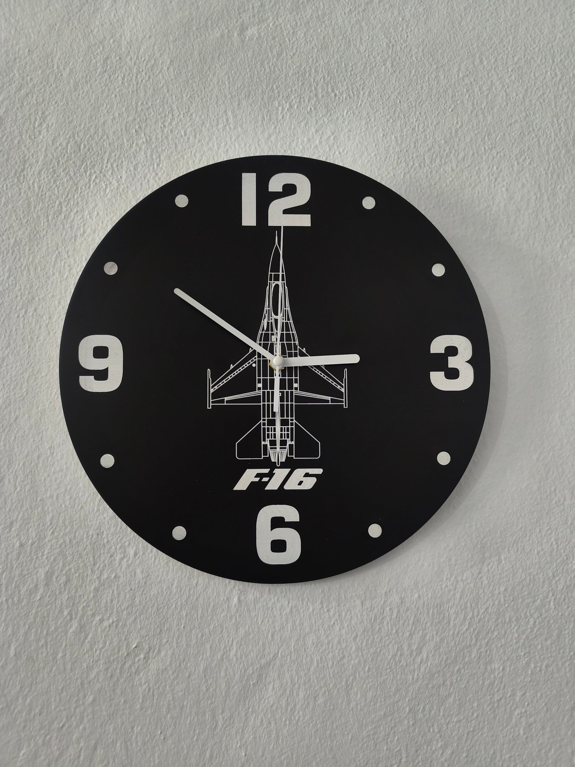 Wall clock with F16 design on a gray wall