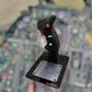 Side of 1:1 scale F-14 replica control stick with switches and trims.