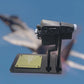 Front view of F-15 throttle replica with dual levers and switches.