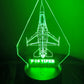 Green-lit F-16 RGB desk light showing detailed aircraft outline.