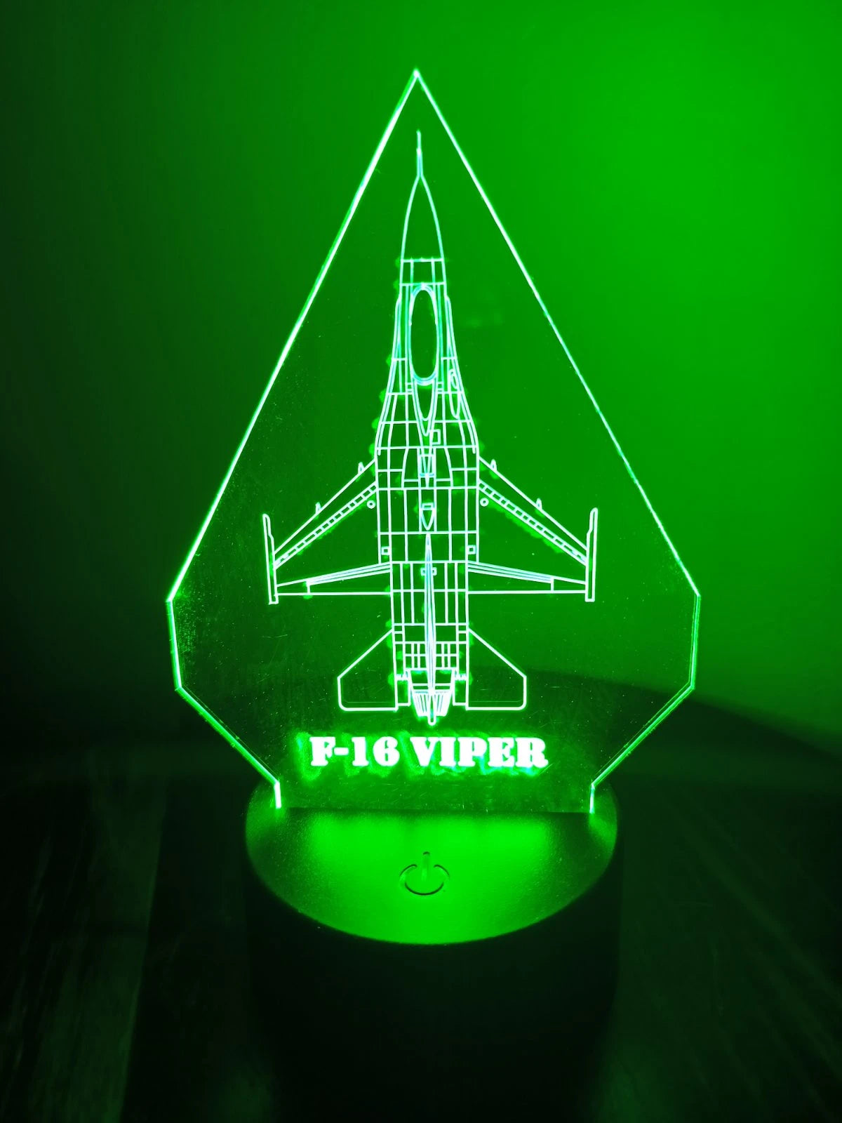 Green-lit F-16 RGB desk light showing detailed aircraft outline.