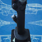 Joystick with 'F-16 Fighting Falcon' branding on a blue background with aircraft illustrations